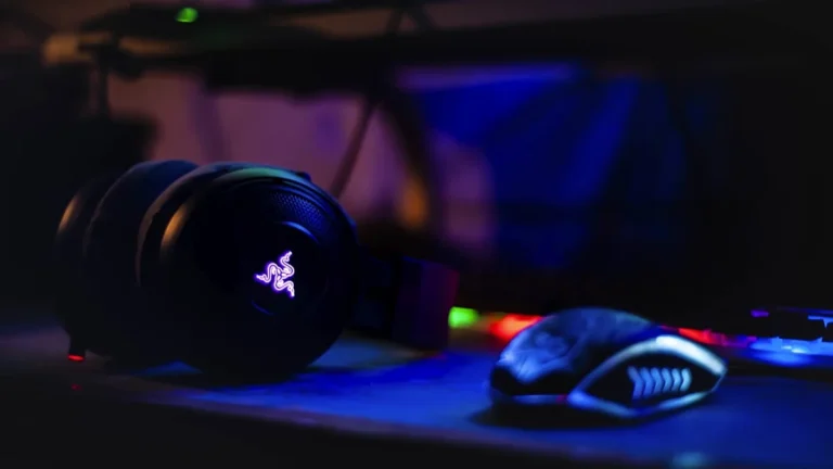 Gaming headset resting near a computer mouse