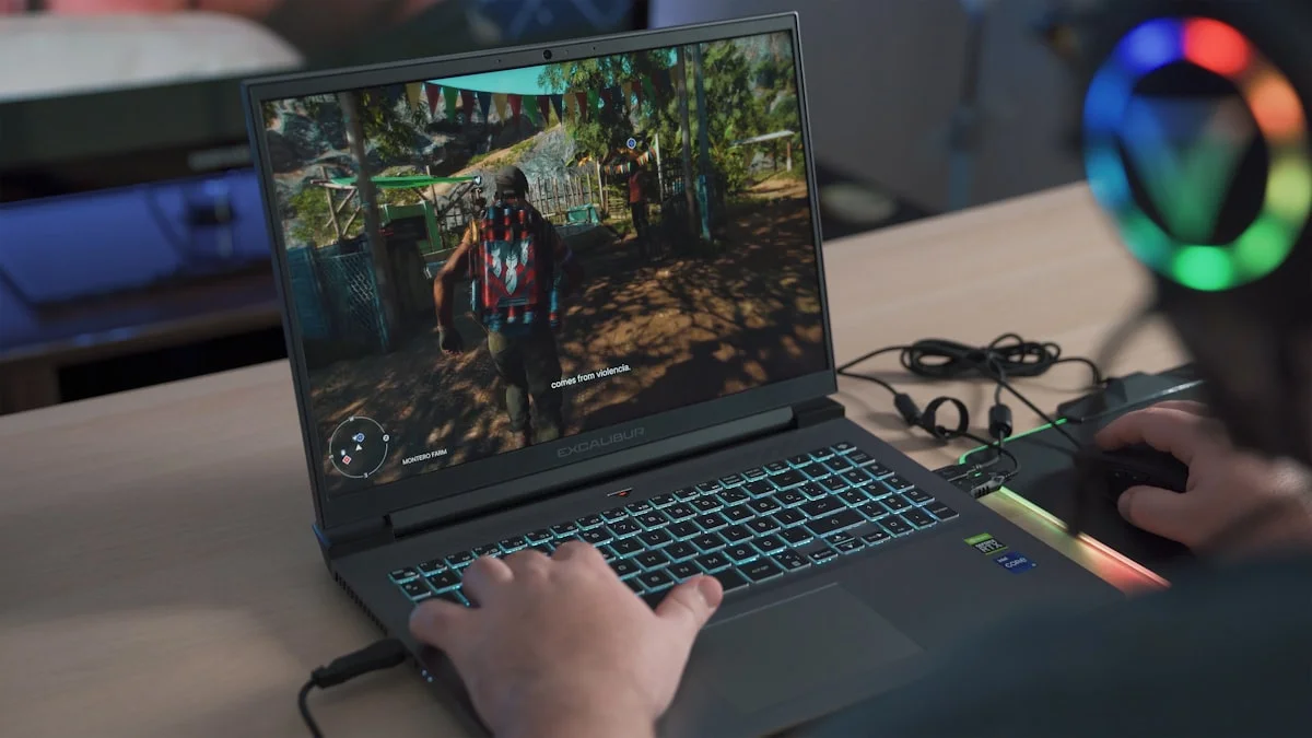 Person playing a video game on a gaming laptop