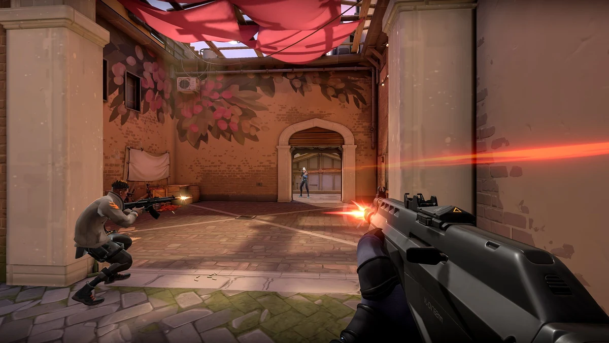 Official VALORANT gameplay screenshot showing agents in battle, Riot Games